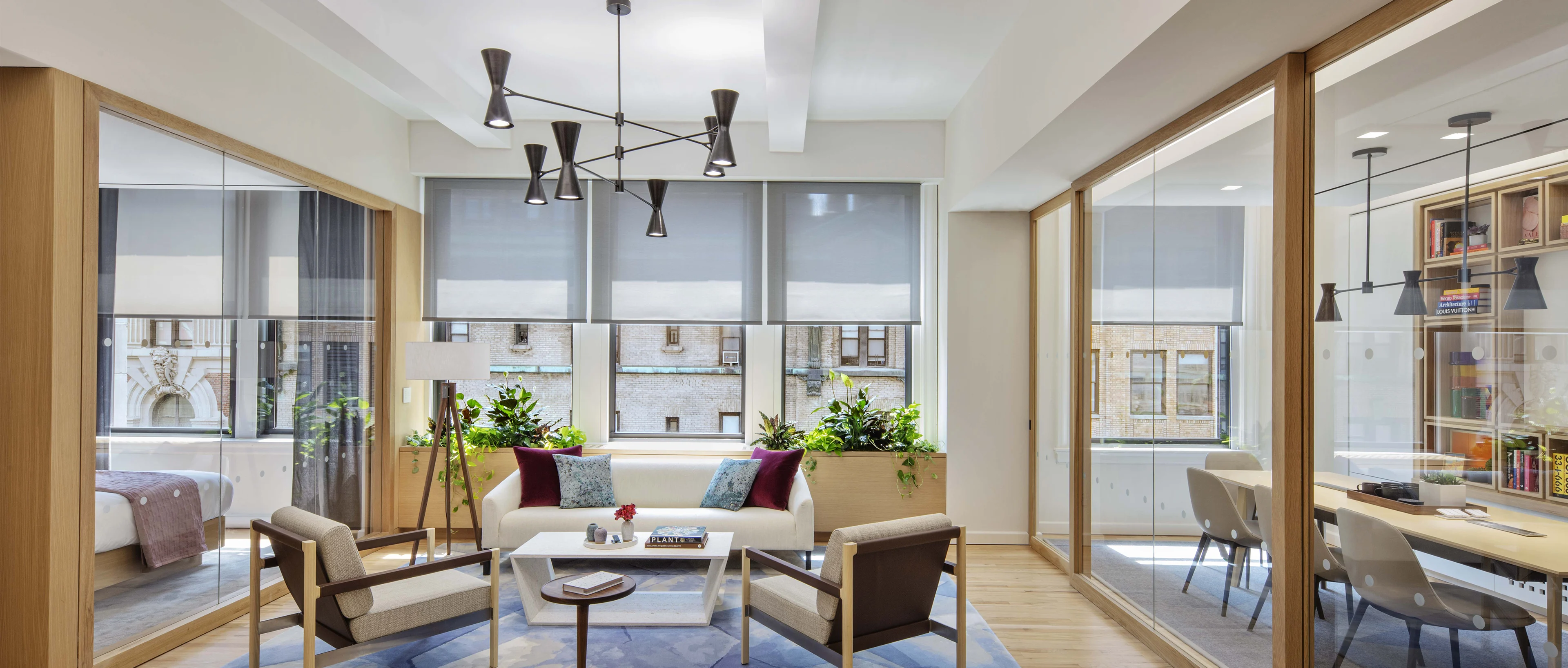 Exterior view of a modern MDU with a swimming pool and lush greenery.