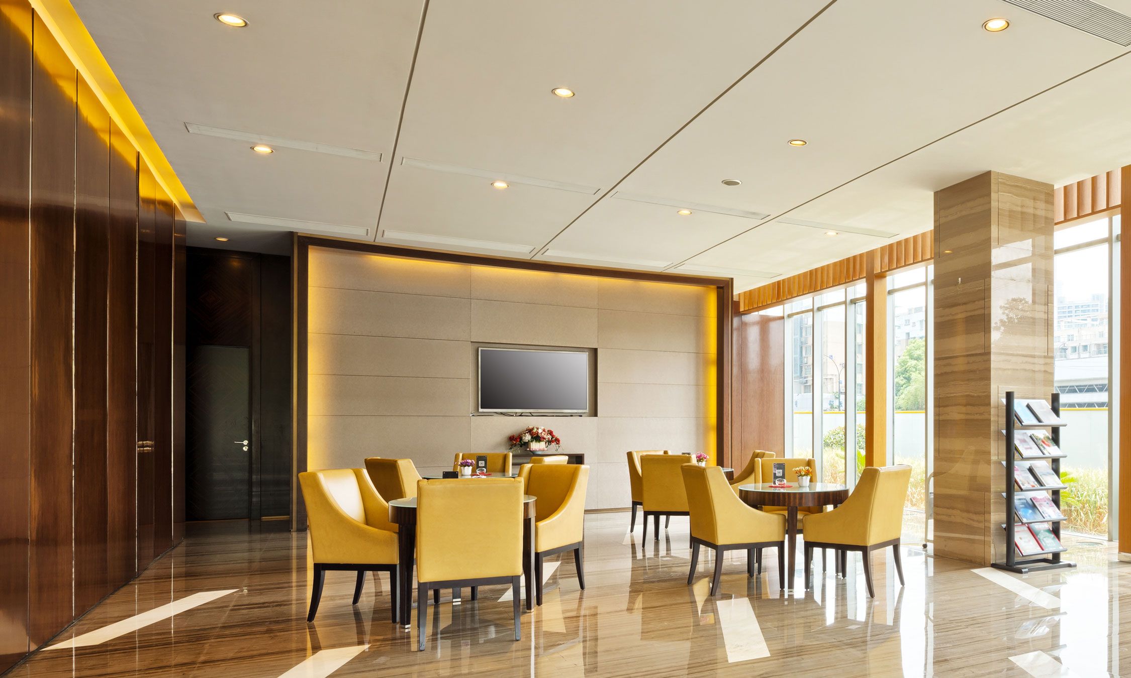 Exterior view of a modern MDU with a swimming pool and lush greenery.